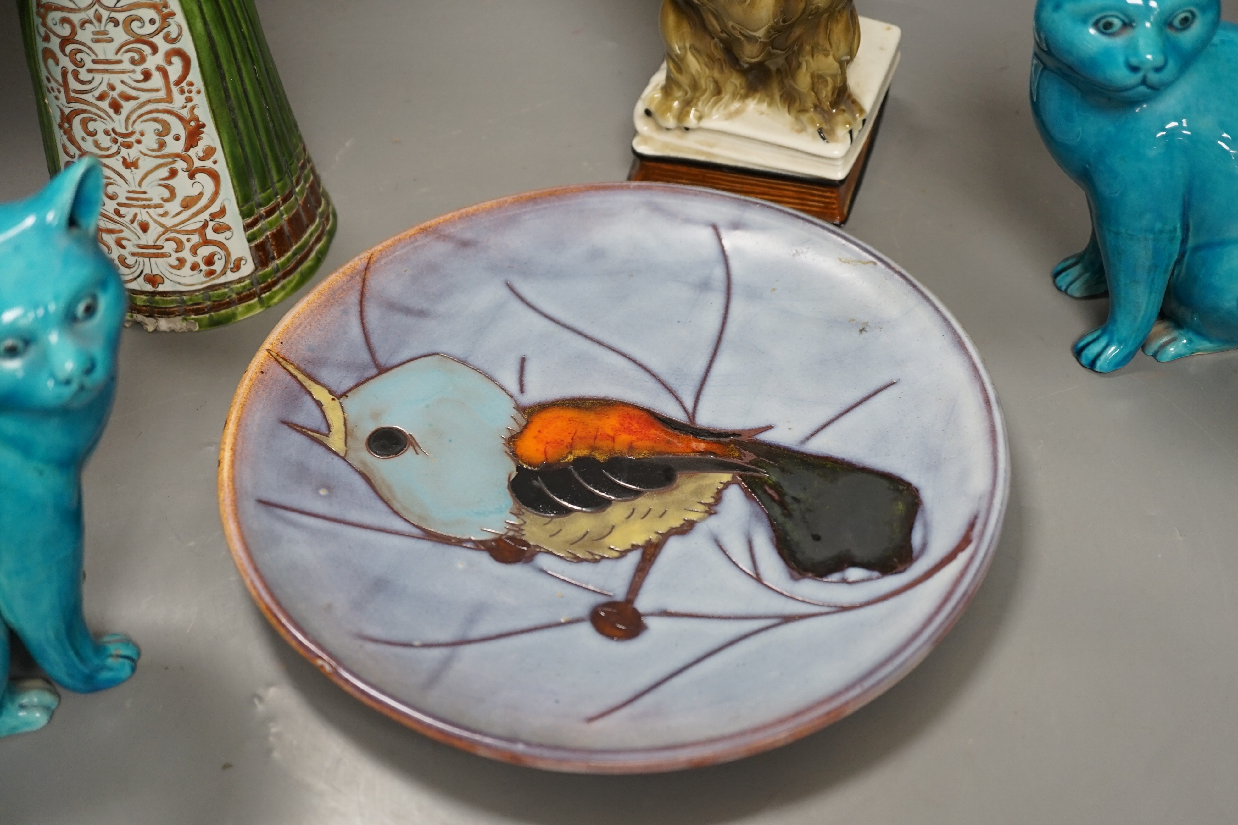 A selection of ceramics, to include two Vallauris plates, a bust of Madonna and child signed ‘Helen Fraser Rock 1925’, a Dutch figure and a pair of turquoise glazed cats etc.